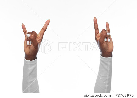 hands of african american woman showing rock sign hands of african american woman showing rock sign 78765976