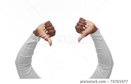 hands of african american woman with thumbs down hands of african american woman with thumbs down 78765977