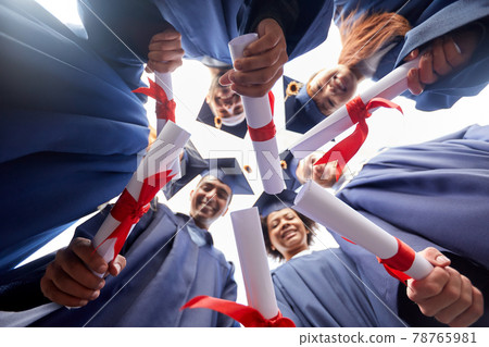 graduate students in mortar boards with diplomas graduate students in mortar boards with diplomas 78765981