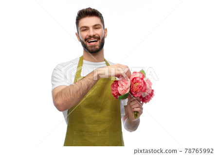 smiling male gardener with bunch of peony flowers smiling male gardener with bunch of peony flowers 78765992