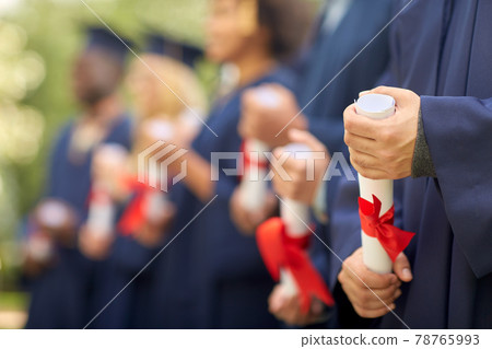 graduate students in mortar boards with diplomas graduate students in mortar boards with diplomas 78765993