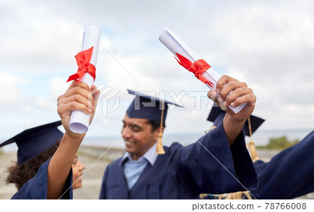 graduate students in mortar boards with diplomas graduate students in mortar boards with diplomas 78766008