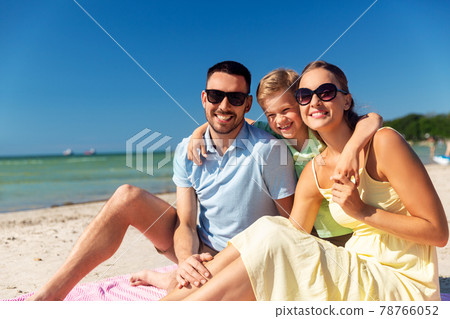 family hugging on summer beach family hugging on summer beach 78766052