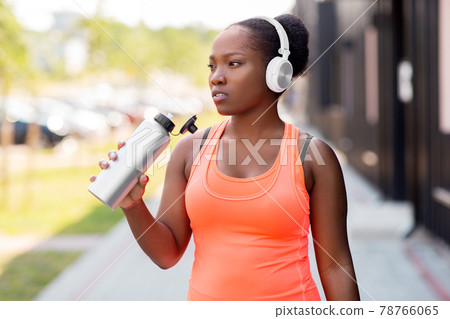 african american woman drinking water after sports african american woman drinking water after sports 78766065