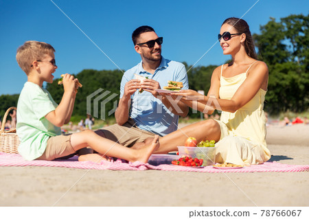 happy family having picnic on summer beach 78766067