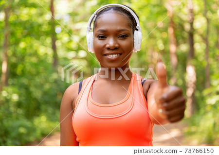 happy african american woman with headphones happy african american woman with headphones 78766150