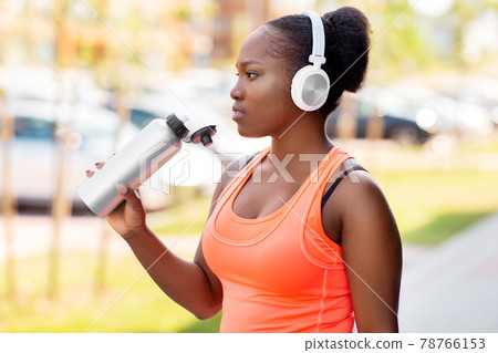 african american woman drinking water after sports african american woman drinking water after sports 78766153