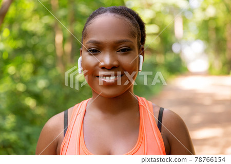 happy african american woman with earphones happy african american woman with earphones 78766154