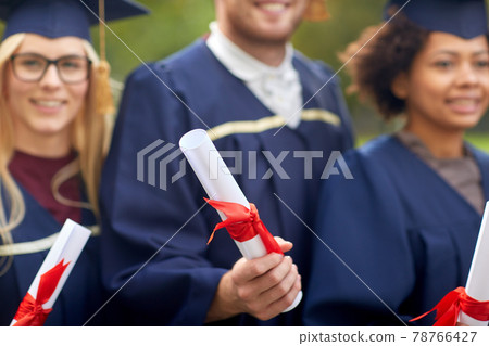 graduate students in mortar boards with diplomas graduate students in mortar boards with diplomas 78766427