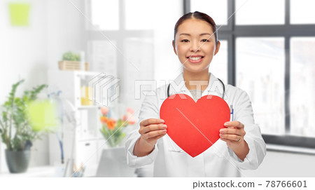 smiling asian female doctor holding red heart 78766601