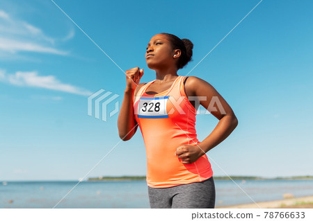 young african american woman running marathon young african american woman running marathon 78766633