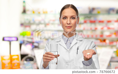 female doctor with medicine and glass of water female doctor with medicine and glass of water 78766672