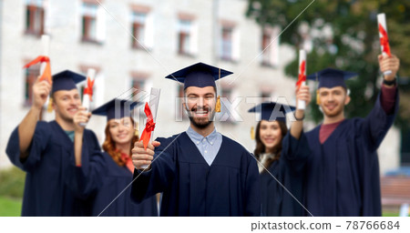 male graduate student in mortar board with diploma 78766684