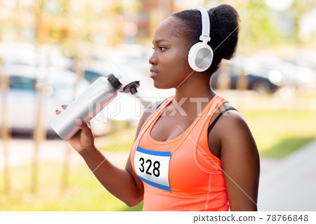 african female marathon runner drinking water african female marathon runner drinking water 78766848