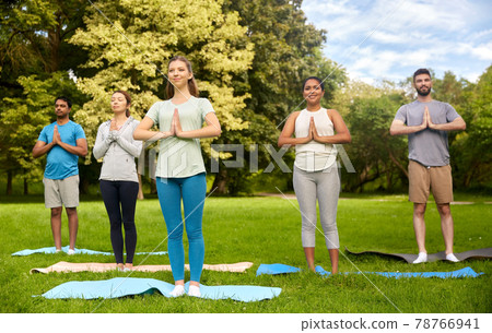 group of people doing yoga at summer park group of people doing yoga at summer park 78766941