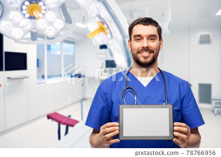 happy doctor or male nurse showing tablet computer happy doctor or male nurse showing tablet computer 78766956
