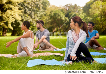 group of people doing yoga at summer park group of people doing yoga at summer park 78766957
