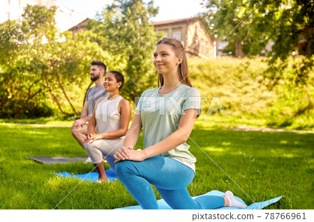group of people doing yoga at summer park group of people doing yoga at summer park 78766961