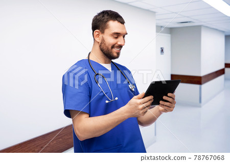 smiling doctor or male nurse using tablet computer smiling doctor or male nurse using tablet computer 78767068