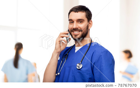 smiling doctor or male nurse calling on smartphone smiling doctor or male nurse calling on smartphone 78767070