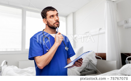 doctor or male nurse with clipboard 78767078