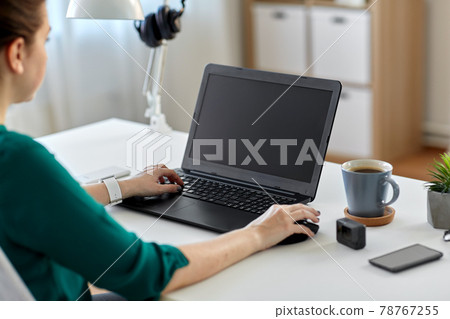 woman with laptop working at home office woman with laptop working at home office 78767255