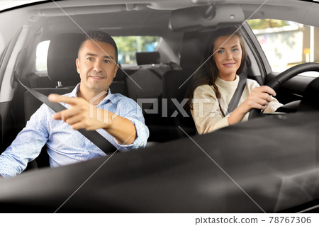 car driving school instructor teaching woman 78767306