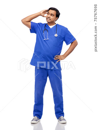 stressed doctor or male nurse in blue uniform stressed doctor or male nurse in blue uniform 78767698