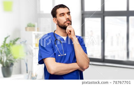 thinking doctor or male nurse with stethoscope thinking doctor or male nurse with stethoscope 78767701