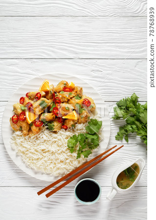Mango glazed spicy chicken breast chunks with rice 78768939