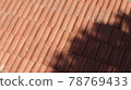 Orange color tile roof background. Close-up of the red clay texture of a house rooftop 78769433