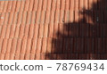 Orange color tile roof background. Close-up of the red clay texture of a house rooftop 78769434
