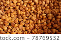 Vegan healthy roasted corn nuts background. Organic sauced corn texture at the spice bazaar in Turkey 78769532