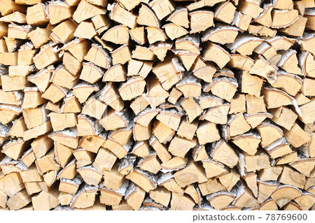 A lot of firewood stacked evenly, texture. Dry birch for furnace. Logs background. Wooden birch logs, bonfire. Closeup, front view. A lot of firewood stacked evenly, texture. Dry birch for furnace. Logs background. Wooden birch logs, bonfire. Closeup, front view. 78769600