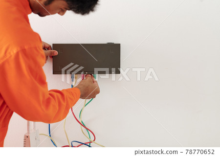 Mounting transmitter box on wall 78770652