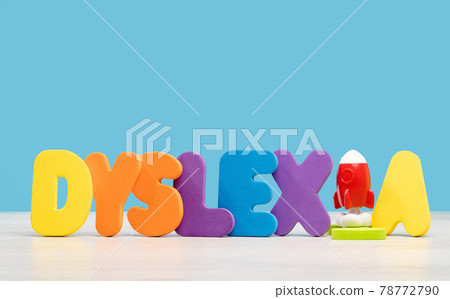 Dyslexia concept, word on a desk with a rocket 78772790