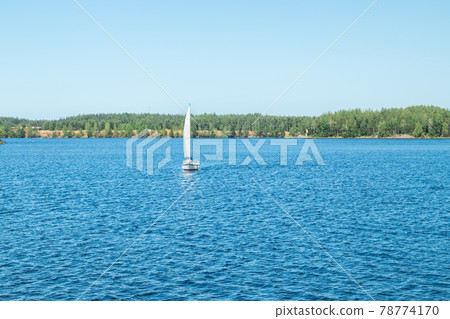 Yacht on the lake Saimaa on a sunny summer day, Lappeenranta, Finland 78774170