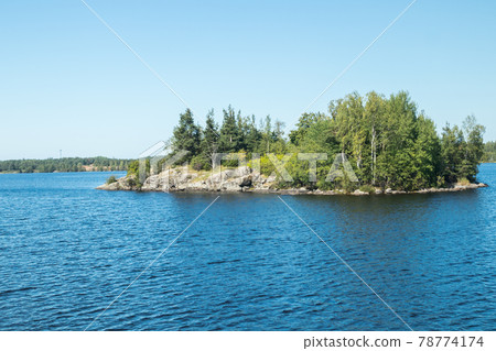 Small rocky island in lake Saimaa, near lappeenranta, Finland. Small rocky island in lake Saimaa, near lappeenranta, Finland. 78774174