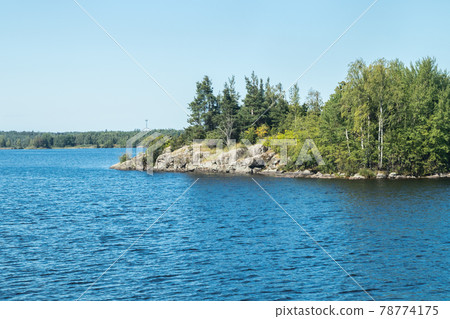 Small rocky island in lake Saimaa, near lappeenranta, Finland. 78774175