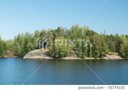 Small rocky island in lake Saimaa, near lappeenranta, Finland. 78774185