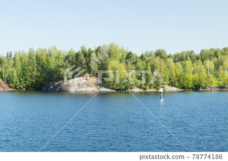 Small rocky island in lake Saimaa, near lappeenranta, Finland. Small rocky island in lake Saimaa, near lappeenranta, Finland. 78774186