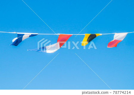 Nautical flags on the ship against blue sky Nautical flags on the ship against blue sky 78774214