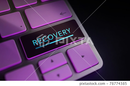 Recovery in Digital Life or Business Concept. Economic Crisis Symbolic. Close Up of Rocket and Startup Sign on Computer Keyboard. Dark tone 78774385