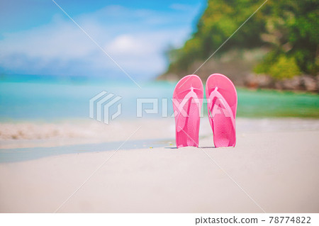 Colorful flipflop pair on the sea beach 78774822