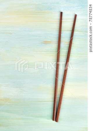 A pair of chopsticks on a blue background with copy space A pair of chopsticks on a blue background with copy space 78774834