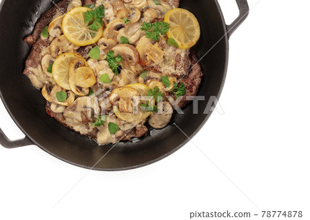 A closeup of scallopine di vitello, traditional Italian dish of veal, with mushroom sauce A closeup of scallopine di vitello, traditional Italian dish of veal, with mushroom sauce 78774878