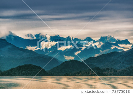 Alaska mountains range snow capped peaks in inside passage, Glacier bay nature landscape at autumn sunset dusk. View from cruise ship travel. 78775018