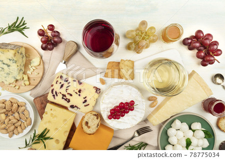 Various types of cheese with wine on a light background 78775034