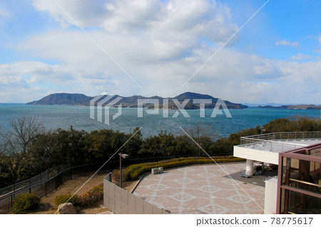 View of the main island and Mukaijima of Marugame City, which is just west from the observation deck of the Yoshima service area. View of the main island and Mukaijima of Marugame City, which is just west from the observation deck of the Yoshima service area. 78775617