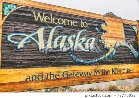 Alaska sign welcome billboad on the South Klondike Highway near Skagway. 78776052
